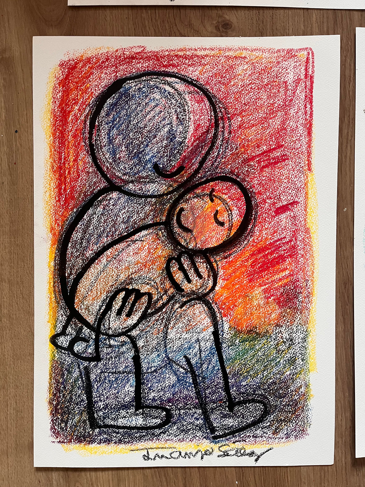 Papá durmiendo al nene, ceras sobre papel, obra original de Juanjo Sáez – detalle de la firma